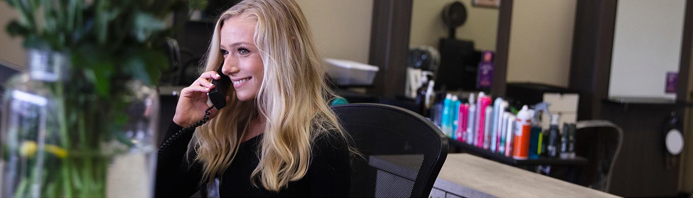 young attractive blond female on the phone